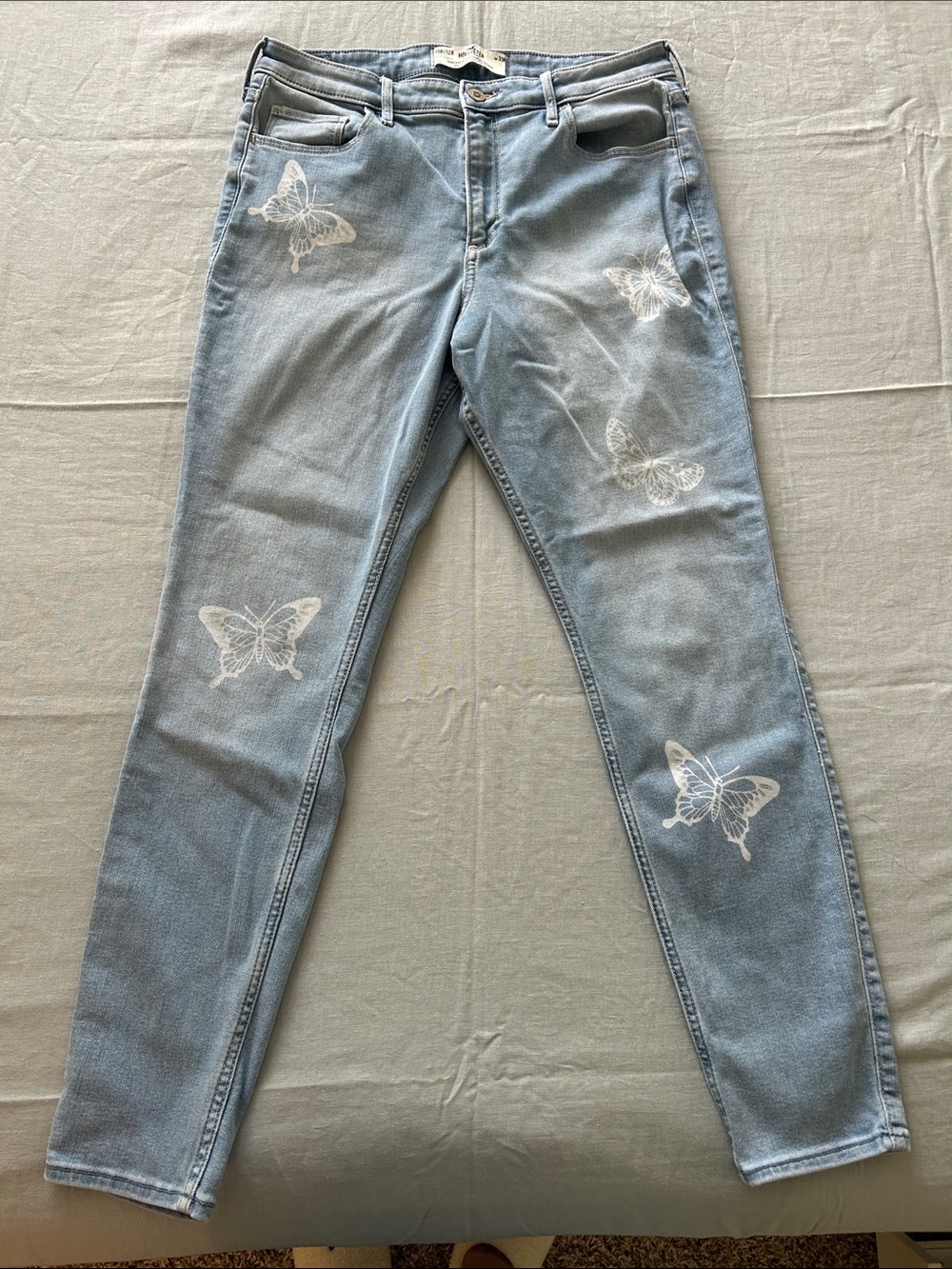 Hollister Light Blue Skinny Jeans with White Butterfly Embroidery